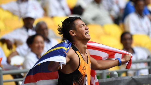 Supporter Malaysia di SEA Games 2022, (Foto: AFP/ADEK BERRY)