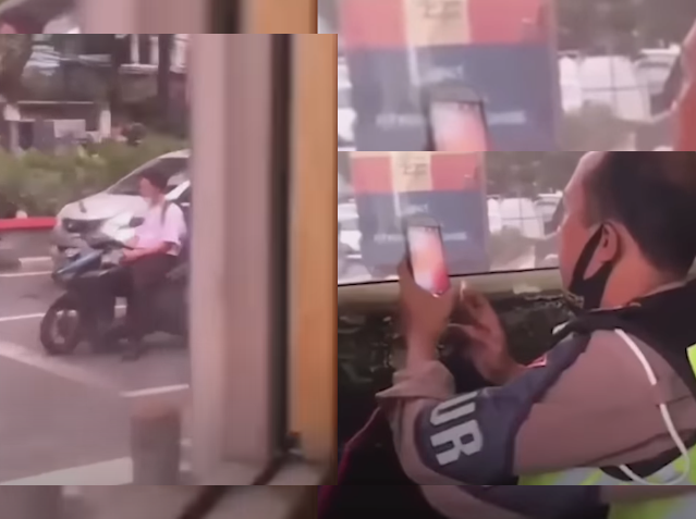 Viral! Video Polisi Duduk Santai saat Menilang Pelanggar lewat Kamera HP/capture youtbe: pikiranrakyat.com